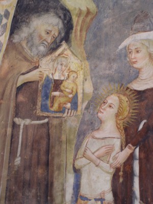 Otra versión de la leyenda: el ermitaño Ananías muestra a la Santa un icono de la Virgen con el Niño. Fresco gótico en S. Maria della Roca, Offida (Italia).