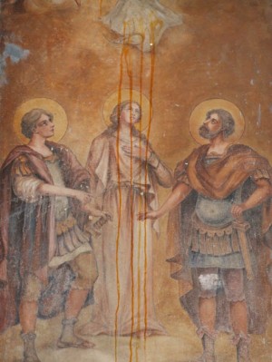 Pintura de los Santos Nicandro, Marciano y Daría, mártires de Escitia Menor, en una capilla de calle en Venafro, Italia.